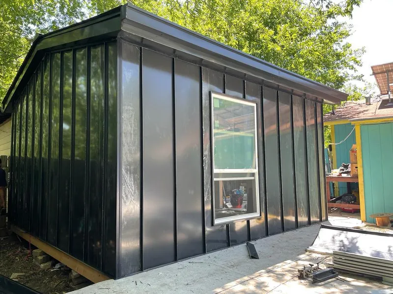 Black standing seam metal wall panels for Roof Inspection in Logan