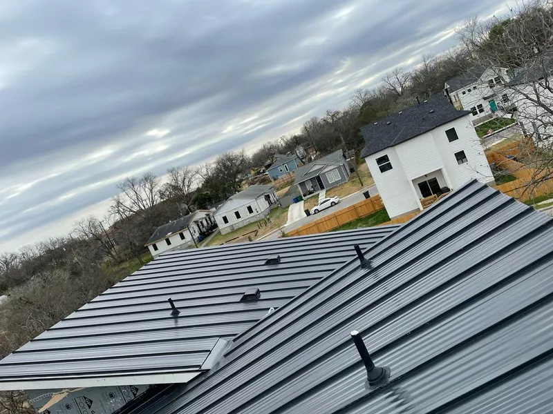 Standing seam metal roof panels with vents for Skylight Repair in Logan